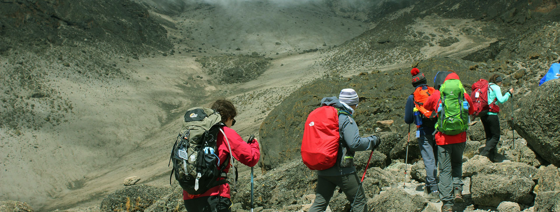 Hikers exploring the volcanic slopes of Oldonyo Lengai in northern Tanzania